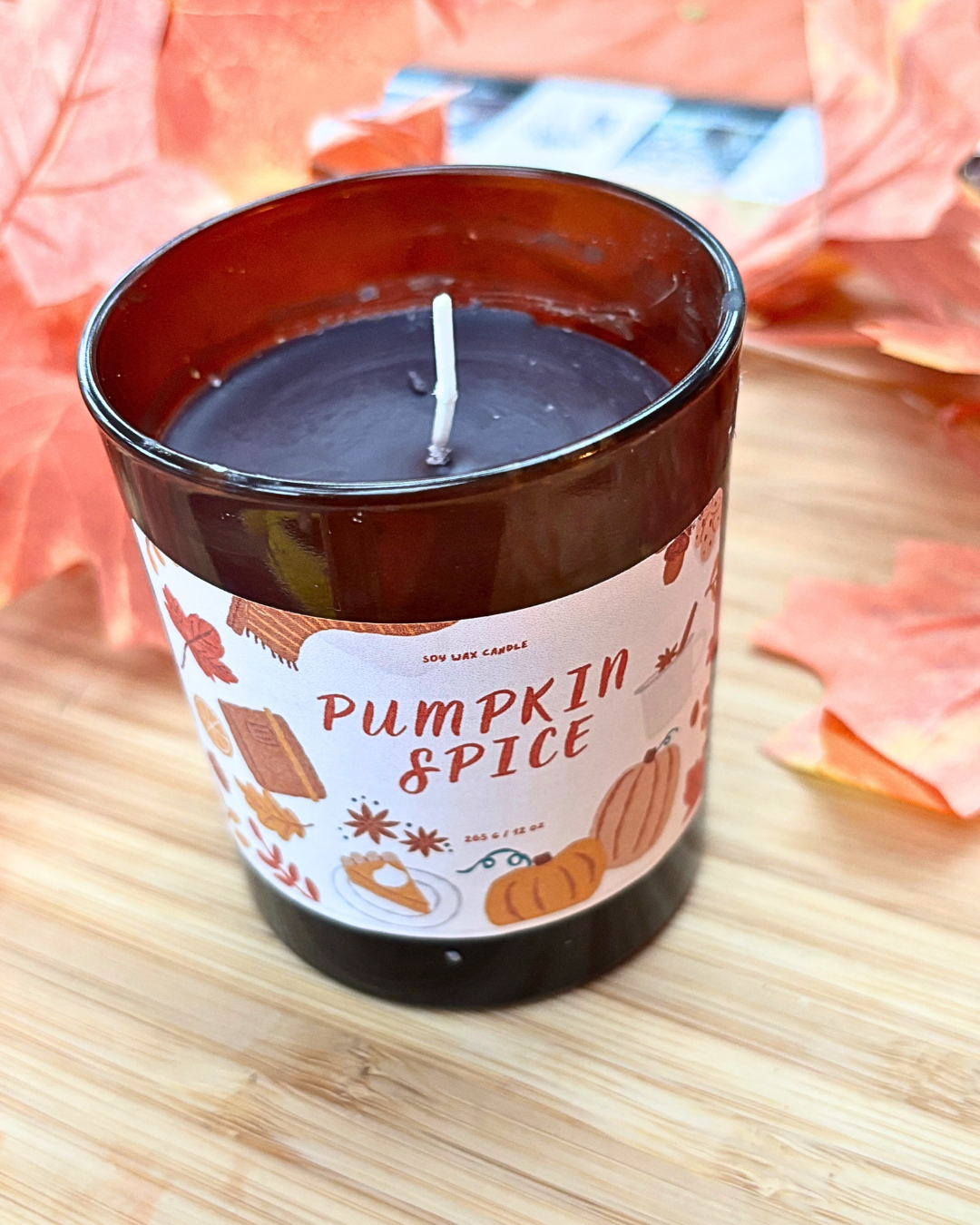 pumpkin spice container candle in amber jar