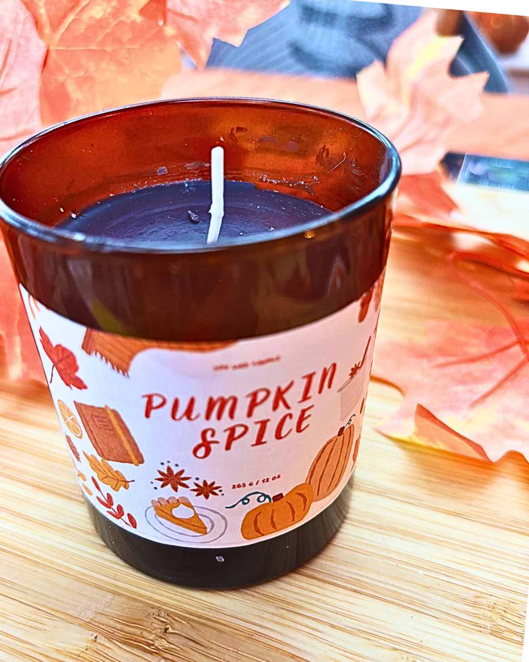pumpkin spice container candle in amber jar